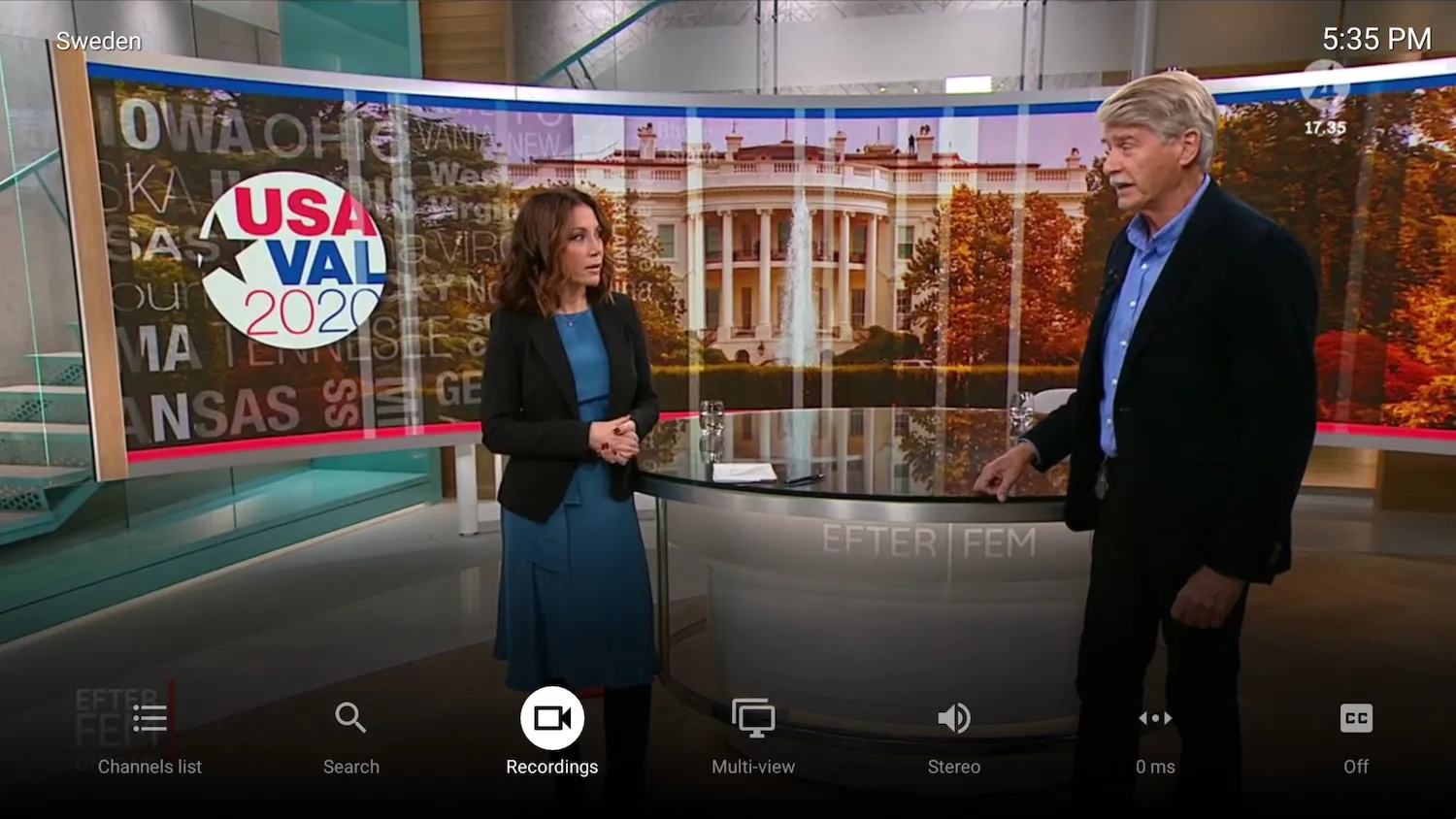Reprodução de TV em direto no TiviMate com a barra de controlos de reprodução no ecrã